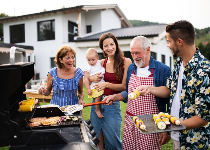 Photo of family enjoying an outdoor barbecue